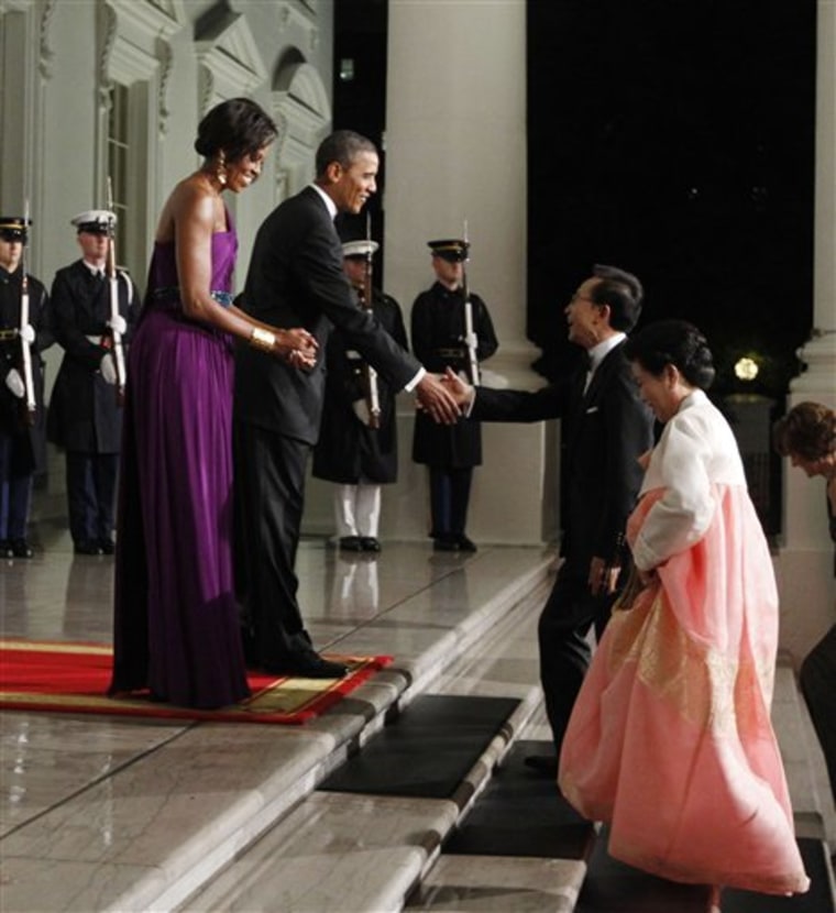 President Barack Obama and first lady Michelle Obama greet South Korean President Lee Myung-bak and his wife Kim Yoon-ok.