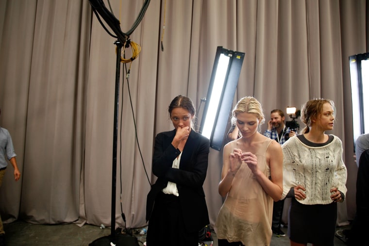 Models get ready backstage prior to the start of the Diesel Black Gold Spring 2012 fashion show during Mercedes-Benz Fashion Week at Pier 94 on Sept. 13, 2011 in New York City.