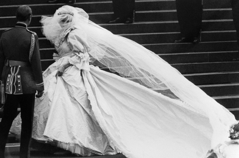 Diana enters her wedding ceremony at St. Paul's Cathedral in her famous dress, designed by David Emanuel.