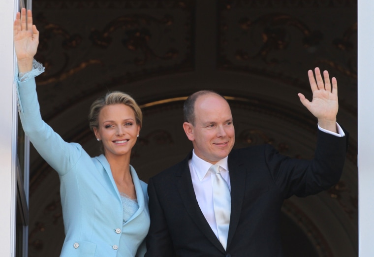 Prince Albert II of Monaco and Princess Charlene of Monaco greet people on the balcony after their civil wedding at the Prince's Palace on July 1.