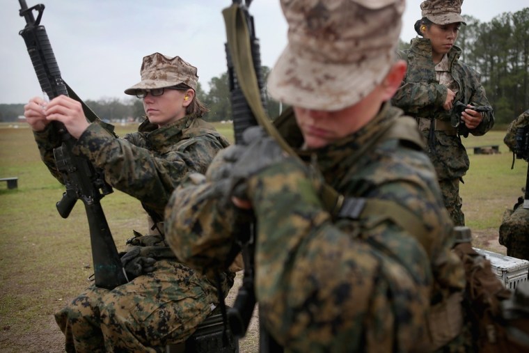Female Marine recruits prepare to fire on the rifle range during boot camp February 25 at MCRD Parris Island, South Carolina. All female enlisted Marines and male Marines who were living east of the Mississippi River when they were recruited attend boot camp at Parris Island. About six percent of enlisted Marines are female.