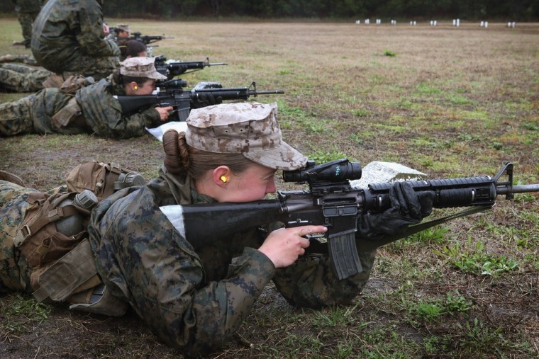 Female Marine recruits fire on the rifle range during boot camp.