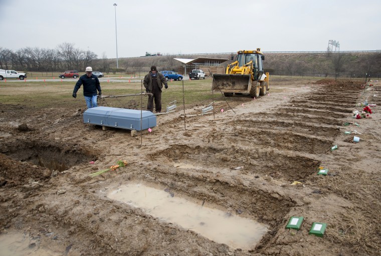 Workers prepare to bury Francisco Carmona on Feb. 6, as graves await the indigent at Meadow View Cemetery, Louisville's current Potter's Field.