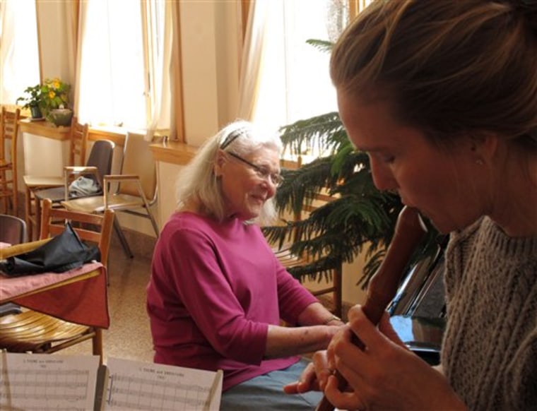Joanne Karp, left, a resident at the Fellowship Community adult home in Chestnut Ridge, N.Y., leads a music lesson with aide Chela Crane on Thursday, ...