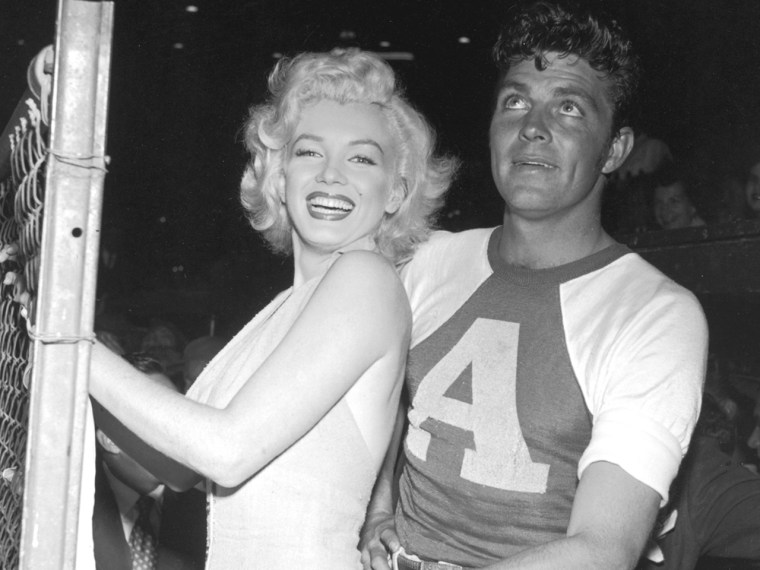Robertson with Marilyn Monroe at a celebrity baseball game in 1952.