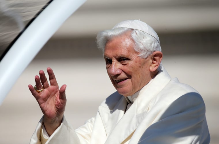 Pope Benedict XVI waves to tens of thousands of pilgrims and well-wishers on Wednesday as the Popemobile transports him through St. Peter's Square.