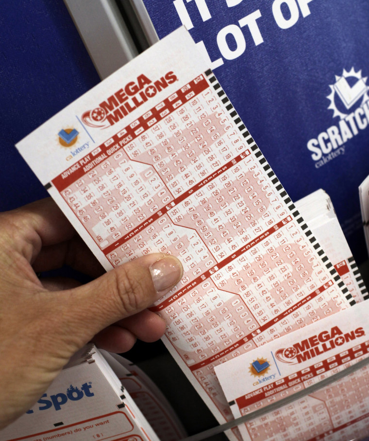 A customer pickets up a Mega Millions lottery ticket in Palo Alto, Calif., on March 30, 2012.