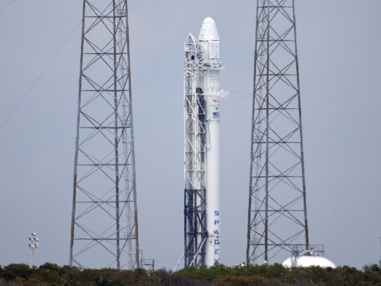 SpaceX's Falcon 9 rocket sits on its launch pad at Cape Canaveral Air Force Station during Monday's pre-launch engine test. The rocket is due to loft a Dragon cargo capsule to the International Space Station on Friday.