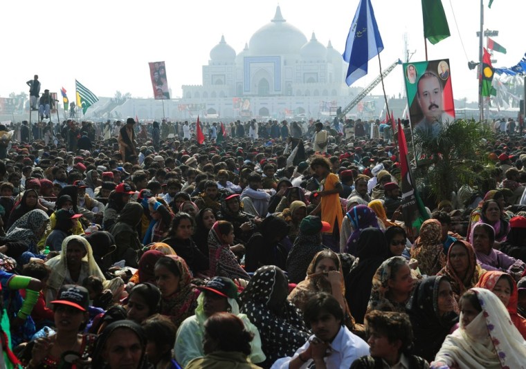 Crowds gather outside the Bhutto family mausoleum in Garhi Khuda Bakhsh on Thursday.