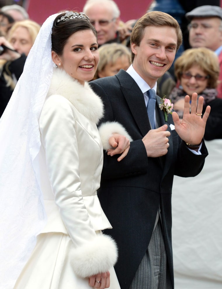 The happy couple poses for photographs after their wedding at the Basilica of Saint Epvre in Nancy, France, on Dec. 29.