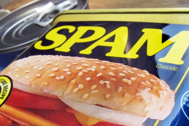 In this Aug. 20, 2009 file photo, a can of Spam is shown on a counter in North Andover, Mass. Hormel, the maker of the iconic meat product, is buying ...