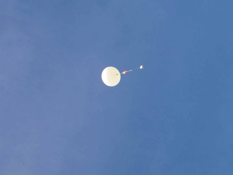 Here's a sharper image of a research balloon in flight with an ozonesonde / radiosonde instrument package attached. This balloon was launched from a National Weather Service facility at the airport in Hilo, Hawaii.