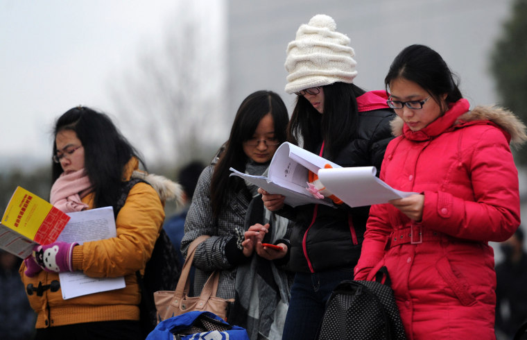 Taking A Full Load: Potential Students Crowd In For Entrance Exams In China