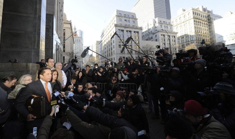 Attorney Mark Heller, left, speaks with reporters outside of Manhattan Criminal Court after filing paperwork on Lindsay Lohan's behalf on Monday.
