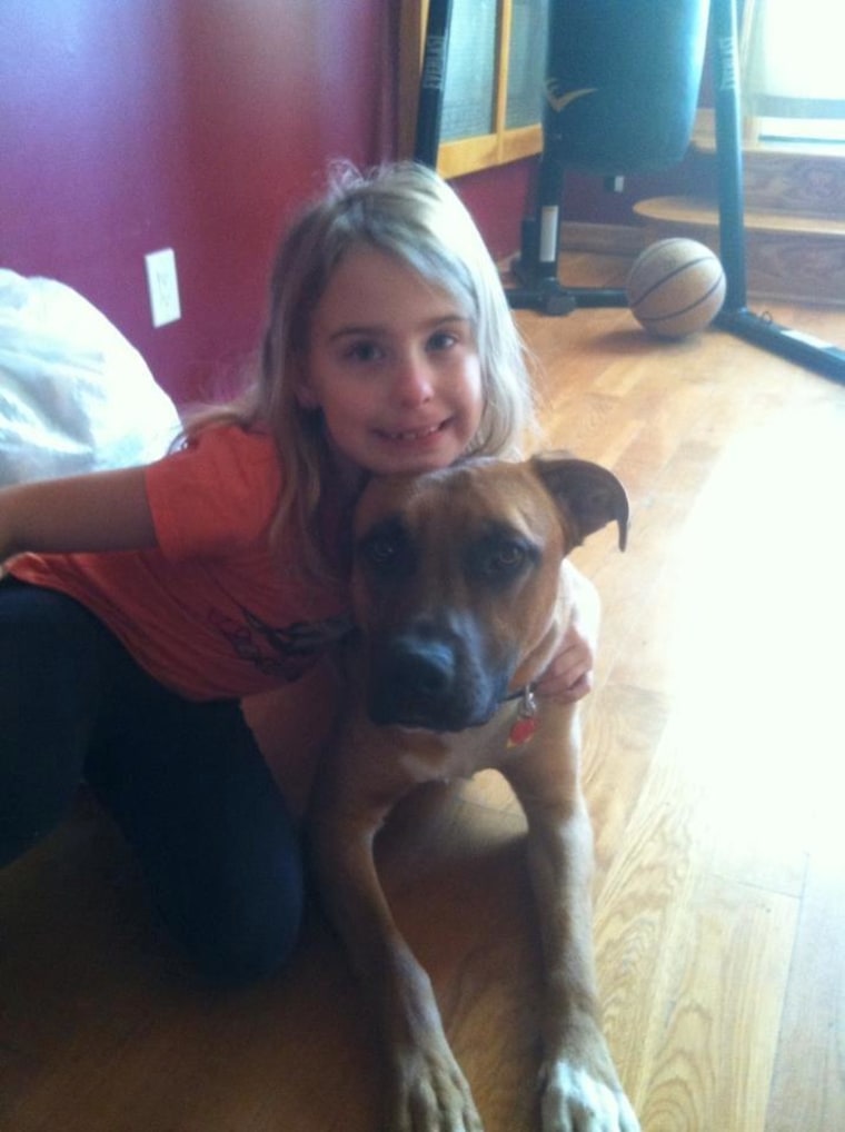 O'Donavan's daughter poses with Buster, who went missing in the middle of November.