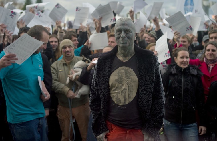 Vladimir Franz react as he stands in front of supporters, cheering as he announces the collection of 88,388 signatures to become eligible for the Czech presidential elections, on Nov. 5, 2012 in Prague.