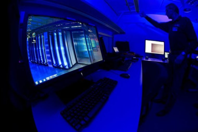 A member of the Cybercrime Center turns on the light in a lab during a media tour at the occasion of the official opening of the Cybercrime Center at ...