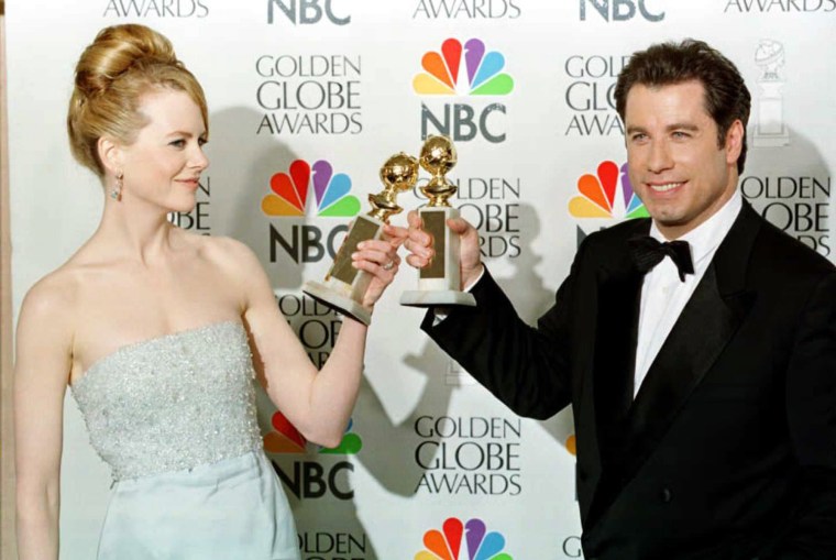 Nicole Kidman and John Travolta toast with their Golden Globe Awards in 1996. Kidman won an award for her performance in \"To Die For.\"