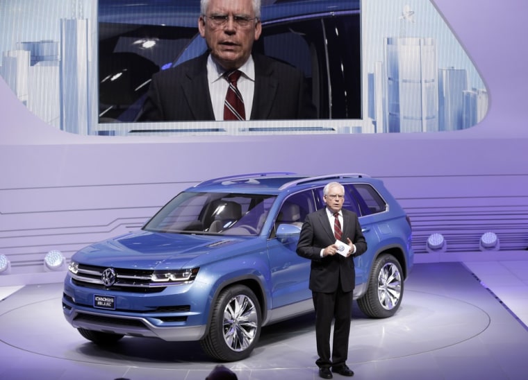 Ulrich Hackenberg, Volkswagen Director of Produce Development for Power Trains stands next to the Volkswagen CrossBlue SUV during the North American I...