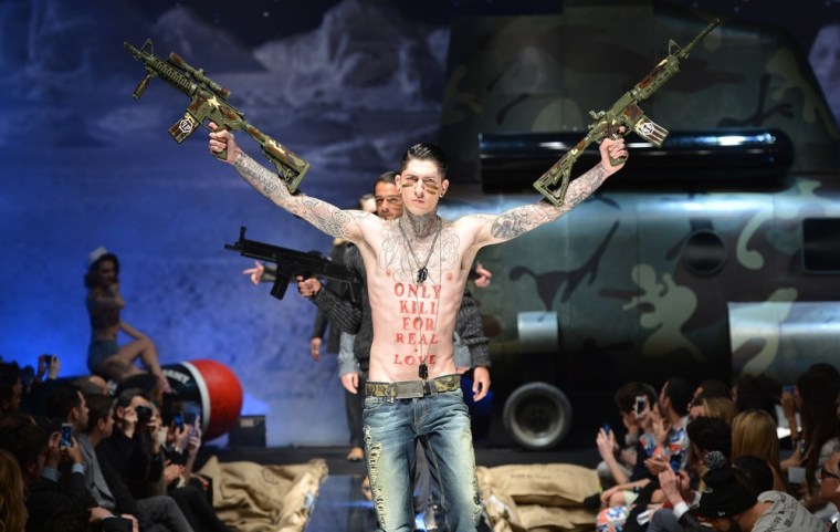 Was one not enough? One model got to hold two guns during the Philipp Plein show.