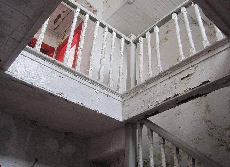 The lighthouse home, which has five floors, is a fixer-upper.