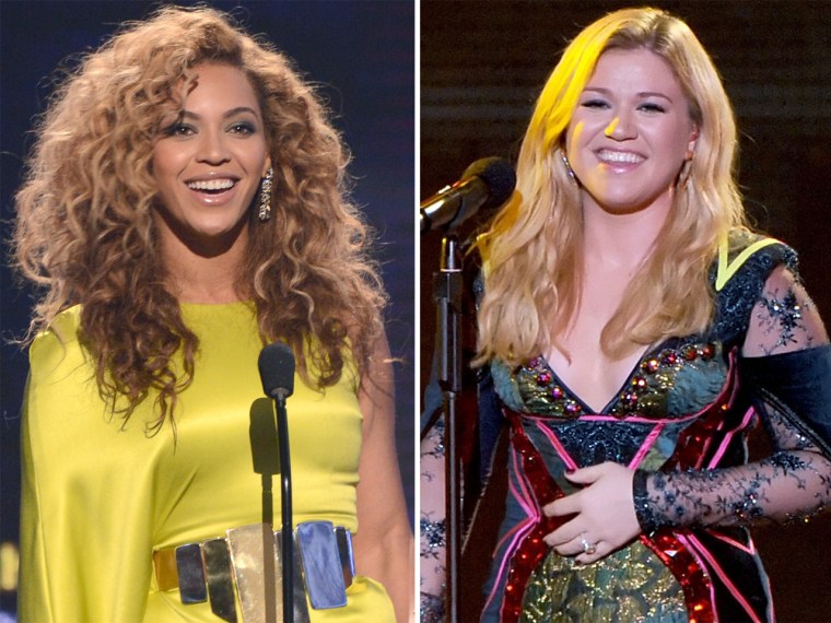 Beyonce accepts the award for Best Female R&B Artist onstage during the 2012 BET Awards, and Kelly Clarkson performs onstage during \"VH1 Divas\" 2012.