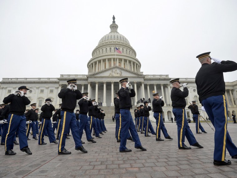 Members of the military band perform during a dress rehearsal at the Capitol on Sunday.