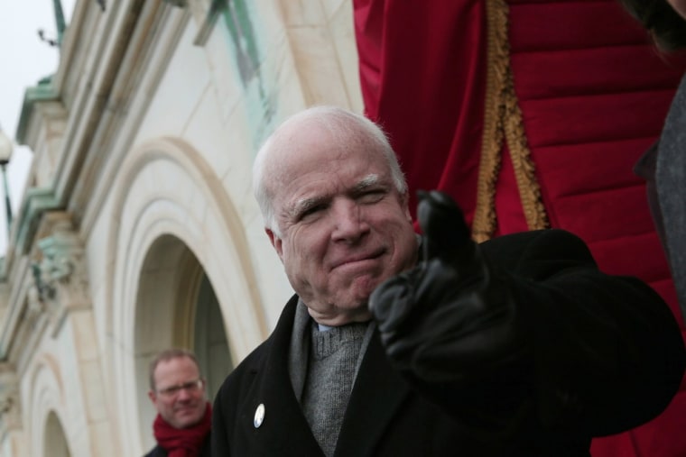 U.S. Senator John McCain (R-AZ) gestures to U.S. Rep. Peter King before the presidential inauguration on the West Front of the U.S. Capitol in Washington D.C. on Jan. 21.