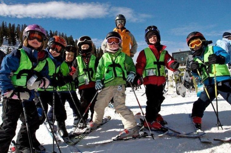 Ski school students pose at Colorado's Arapahoe Basin.