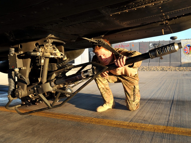 Prince Harry, pictured in January of 2012, doing a pre-flight check of his Apache helicopter.