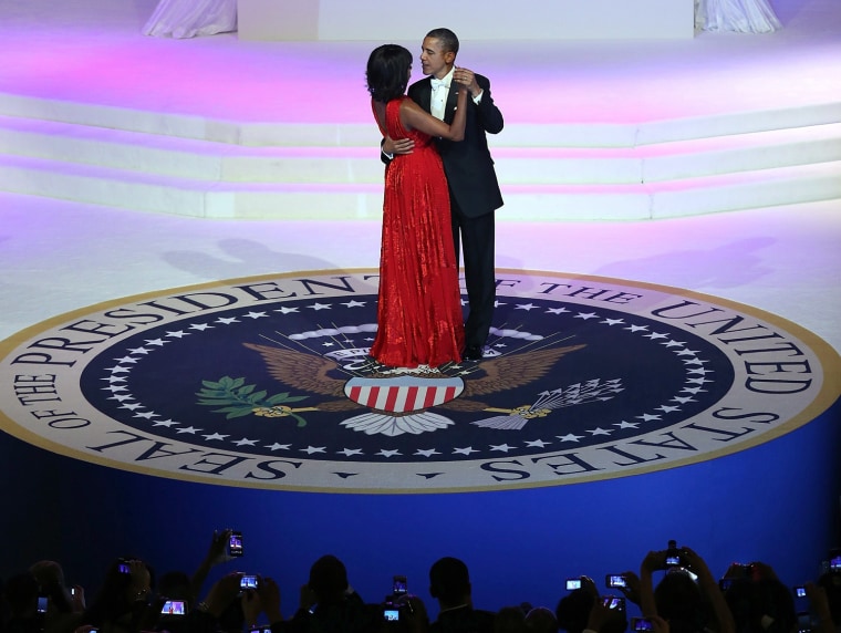 US President Barack Obama dances with first lady Michelle Obama at the Commander-in-Chief Ball in Washington, DC on Monday, Jan. 21.