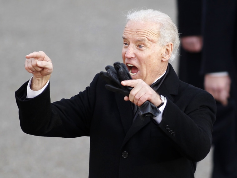 Vice President Joe Biden waves to the crowd in his usual animated fashion during the inaugural parade.