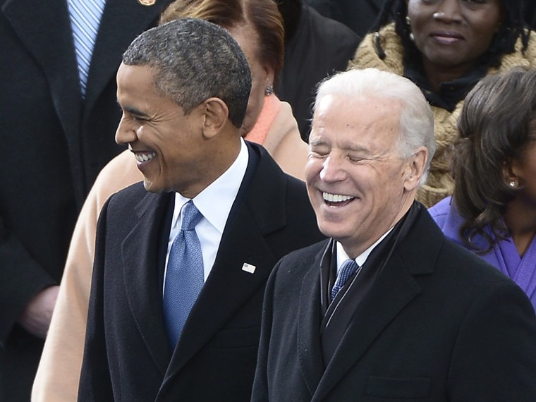 Biden shares a laugh with President Obama during the inauguration ceremony on the West Front of the US Capitol before  Obama is ceremonially sworn in for a second term as the 44th President of the United States.