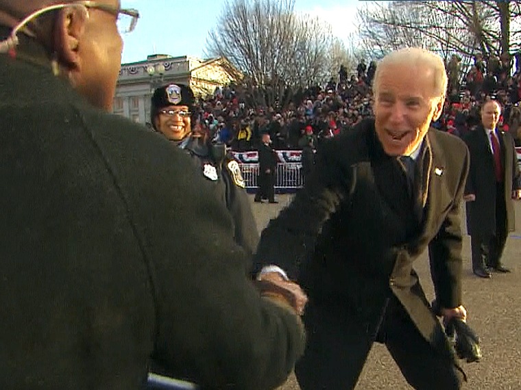 Vice President Joe Biden shakes hands with Al Roker during the inauguration parade.