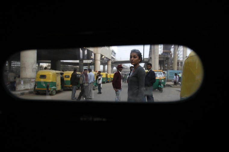 Aanchal Sukhija waits for an auto rickshaw outside a metro station in Gurgaon on the outskirts of New Delhi.