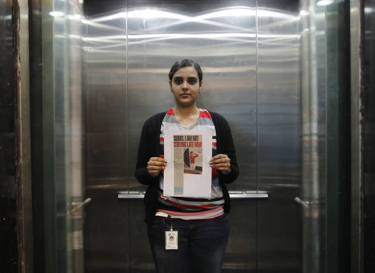 Deepshikha Bharadwaj stands inside an elevator in her office on the outskirts of New Delhi.