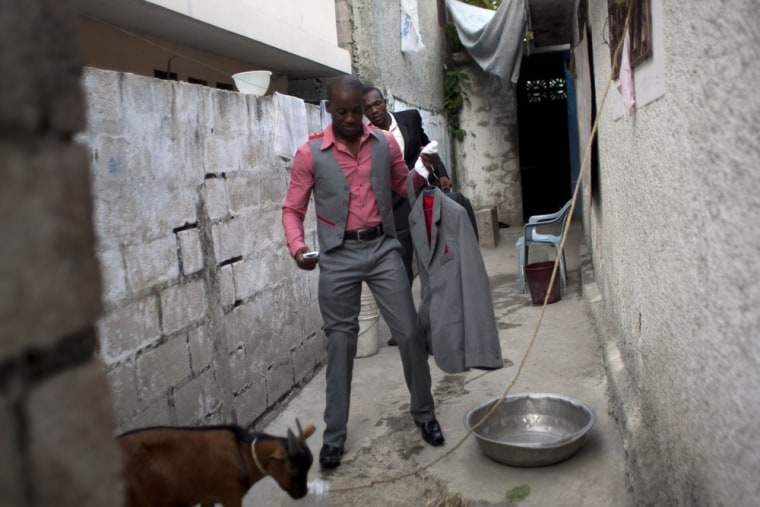 Exantus walks out of his home to his wedding ceremony in Port-au-Prince.