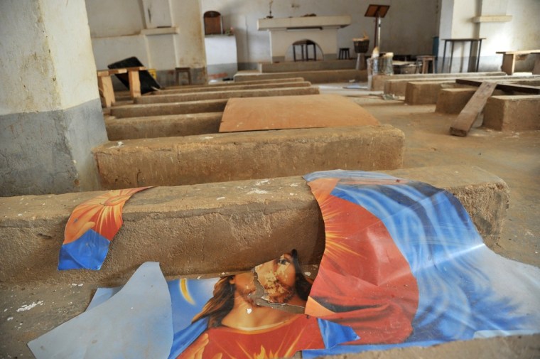 A ripped up image of Jesus Christ is left on the ground of a Catholic church in Diabaly on Tuesday.
