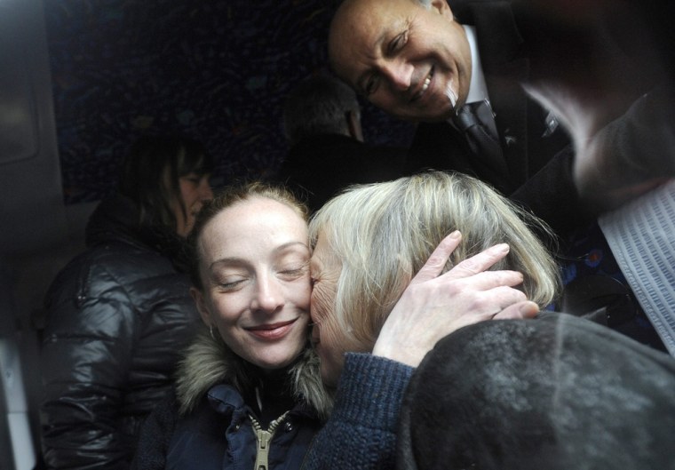 Florence Cassez embraces her mother Charlotte Cassez, as French Minister for Foreign Affairs Laurent Fabius looks on, upon her arrival in Paris on Jan. 24.