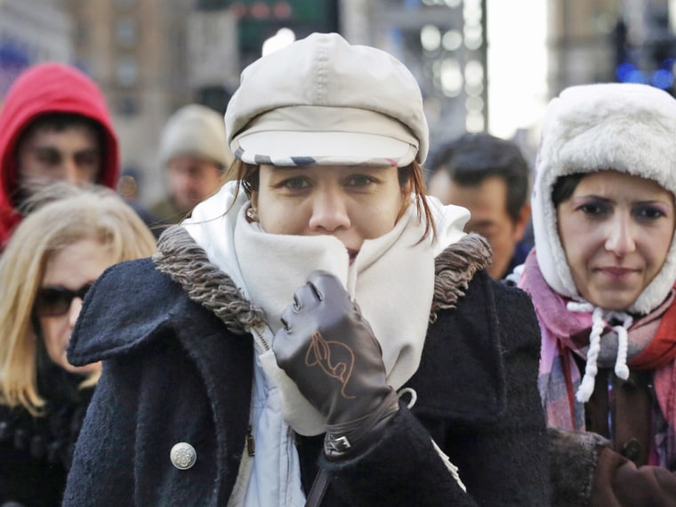 People are bundled up against the cold on New York's 34th Street in Midtown Manhattan on Wednesday. The temperature was around 12 degrees, but with wind gusts of 15-20 mph, it felt more like five below.