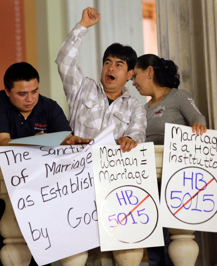 Demonstrators opposed to same-sex marriage during a rally at the Statehouse, in Providence, R.I. on Tuesday.