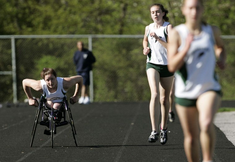 Wheelchair athlete Tatyana McFadden, 16, races along side other runners in her first track meet along side able-bodied high school runners in Rockville, Md.