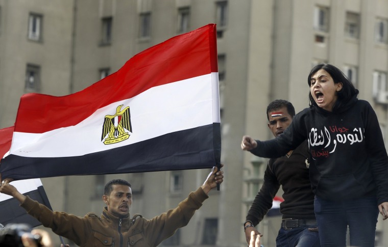 Protesters opposing Egyptian President Mohamed Mursi shout slogans at Tahrir Square in Cairo, on Jan. 25.