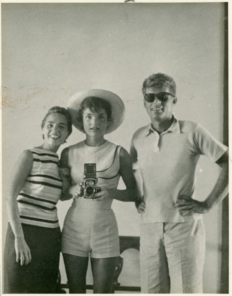 John F. Kennedy is pictured with his wife Jackie and sister-in-law Ethel Kennedy in 1954 in a photo from the personal collection of Kennedy adviser Dave Powers that will be auctioned off on Feb. 17. The photo was taken by Jackie while the three looked into a mirror.