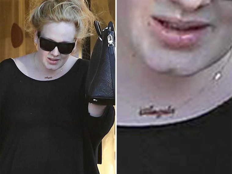 Adele sports her name necklace.