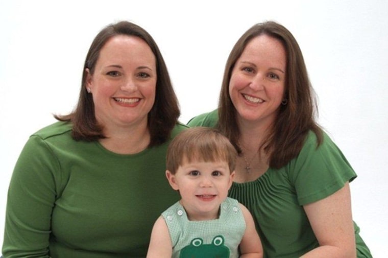 Ashley Broadway, left, is pictured with her wife, Lt. Col. Heather Mack and their 2-year-old son.