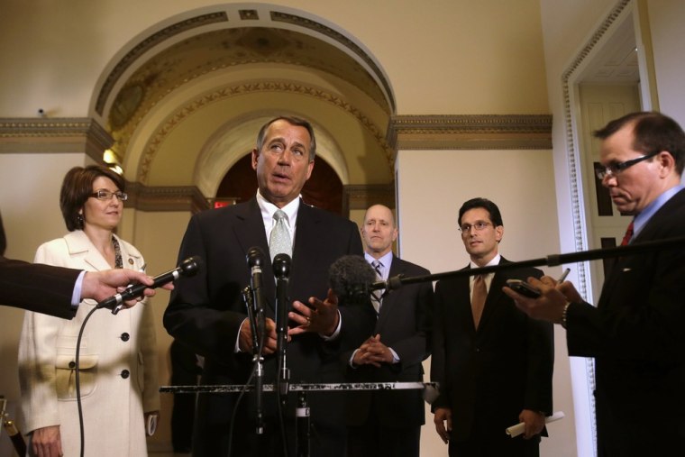 House Speaker John Boehner of Ohio, center, speaks during a news conference on Capitol Hill in Washington, Wednesday, Jan. 23, 2013, to discuss the de...