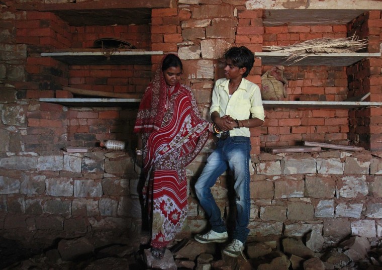 July 17, 2012: Krishna, then aged 13, stands with Kishan Gopal, then 15, inside a newly constructed room at her house.