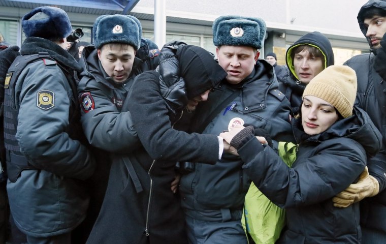 Russian Interior Ministry officers detain two gay rights activists during an unsanctioned protest in front of the Duma, Russia's lower house of parliament, in Moscow on Friday.
