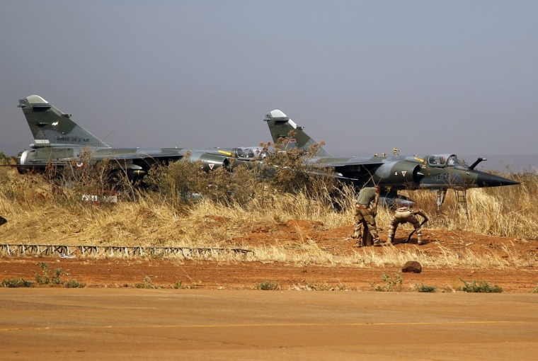 French fighter jets stand in the airport of Bamako, Mali. The United States agreed to fly tankers to refuel French fighters and bombers attacking militants who have established a foothold in Mali, expanding American involvement in the conflict.